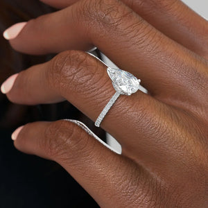 The Pave Nelly Set With A 1.5 Carat Pear Moissanite