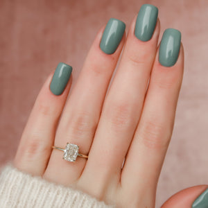 The Crown Kamellie Set With A 4.5 Carat Elongated Cushion Moissanite