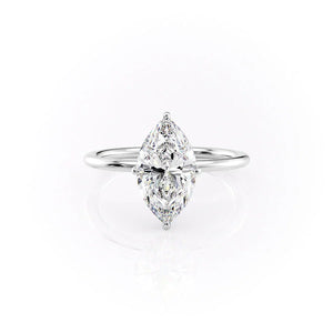 The Crown Kamellie Set With A 1.5 Carat Marquise Moissanite