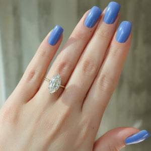 The Crown Kamellie Set With A 1.5 Carat Marquise Moissanite