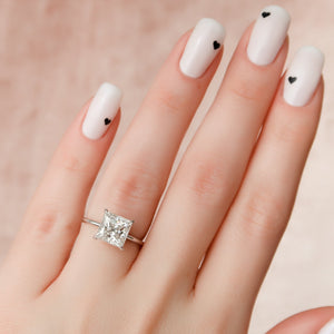 The Crown Kamellie Set With A 1.5 Carat Princess Moissanite