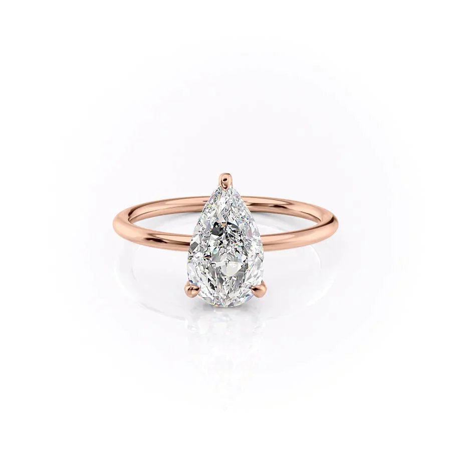 The Crown Kamellie Set With A 1.5 Carat Pear Lab Diamond
