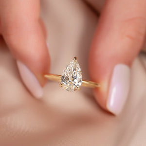 The Crown Kamellie Set With A 2.5 Carat Pear Moissanite