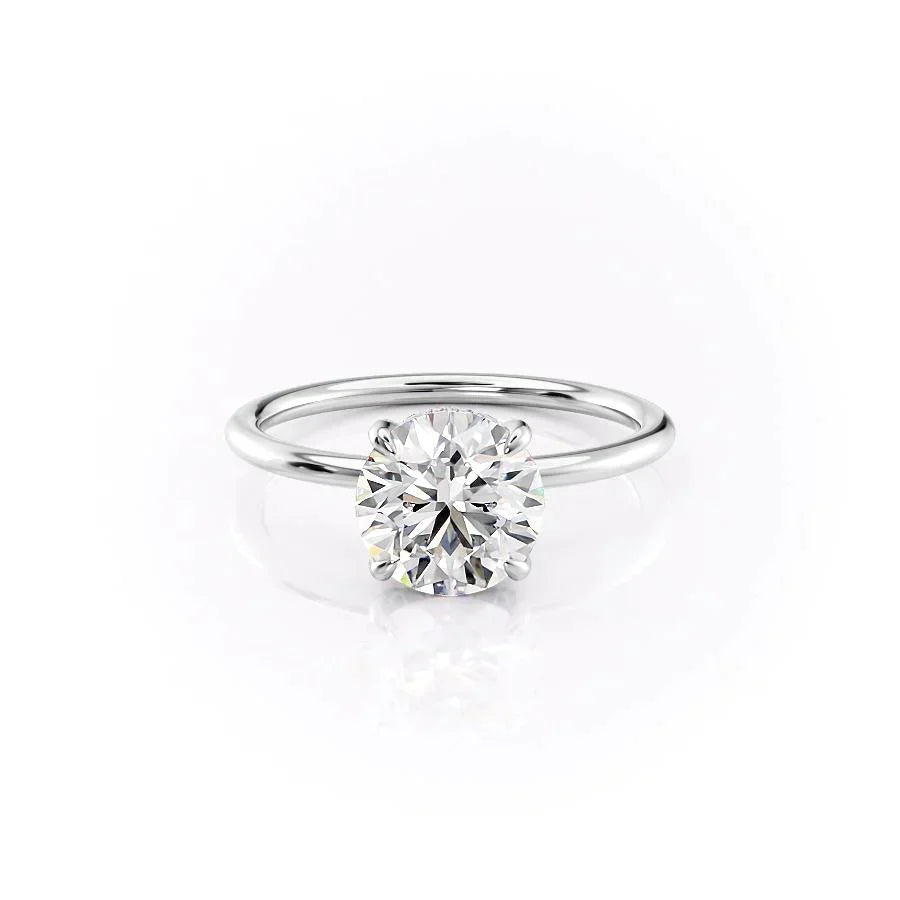 The Crown Kamellie Set With A 1.5 Carat Round Moissanite