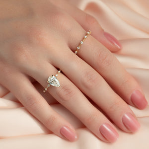 The Penelope Set With A 4.5 Carat Pear Moissanite