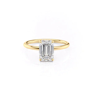 The Low Profile Kamellie Set With A Emerald Moissanite