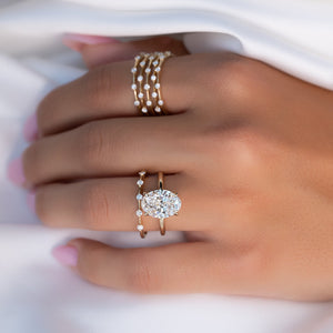 The Petal Kamellie Set With A 2 Carat Oval Lab Diamond