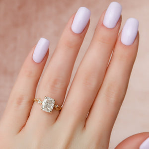 The Three Stone Twig Set With A 2.5 Carat Elongated Cushion Moissanite