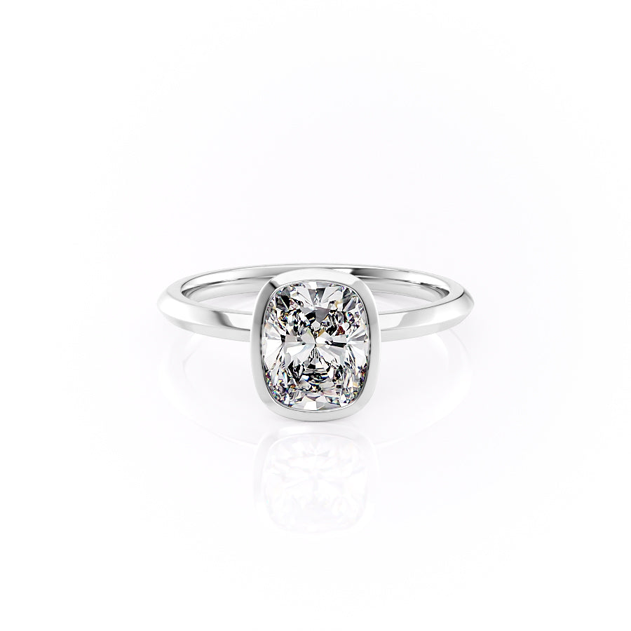 The Razor Bezel Kamellie Set With A 1.5 Carat Elongated Cushion Moissanite