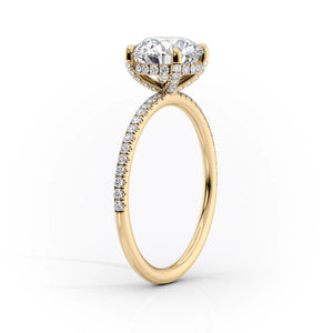 The Pave Crown Kamellie Set With A 1.5 Carat Pear Moissanite